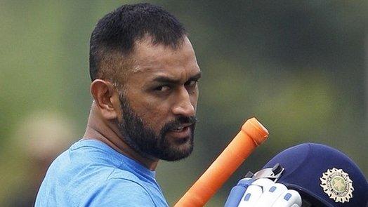 ndia"s one-day cricket team captain, Mahendra Singh Dhoni, walks to bat at the nets during a practice session ahead of their fifth and last one-day international cricket match against New Zealand in Vishakhapatnam, India, Friday, Oct. 28, 2016.