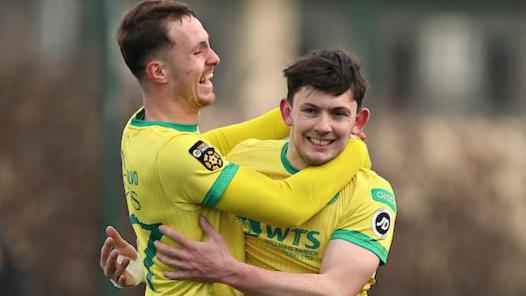 Caernarfon Town's Morgan Owen (R) celebrates