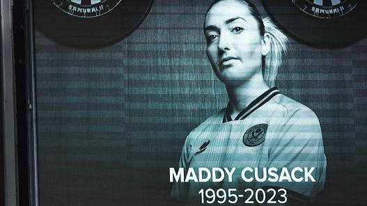 A scoreboard tribute to footballer Maddy Cusack at Sheffield United's Bramall Lane stadium after her death