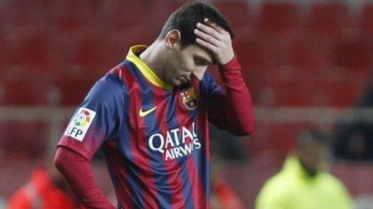 Barcelona's Lionel Messi reacts during their La Liga match against Sevilla