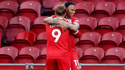 Middlesbrough player Morgan Whittaker celebrates with team-mate Tommy Conway after scoring against Sheffield Wednesday