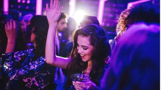 A woman dancing in a nightclub