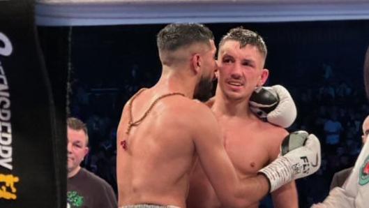 Shabaz Mamoud consoles fellow Shropshire boxer Liam Davies after being hin on points in Birmingham 