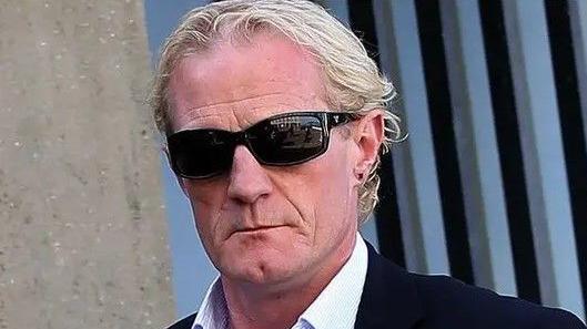 Colin Hendry has blonde hair and is wearing sunnies, a white shirt and dark jacket.