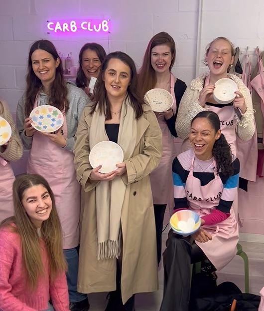 Women at a pottery painting event