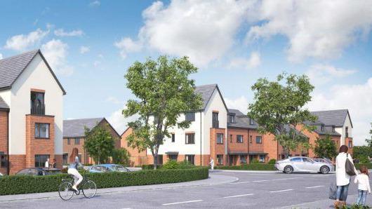 A computer-generated vision of a new build housing estate, with a computer-generated cyclist heading along a computer-generated tree-lined street