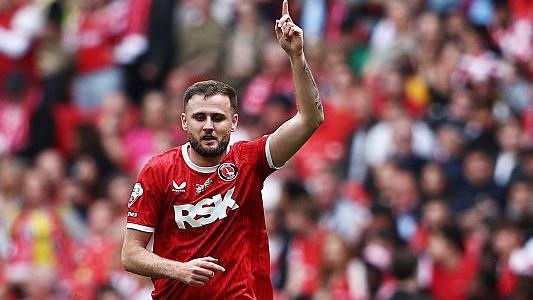 Macaulay Gillesphey celebrating his goal in the League One play-off final win over Leyton Orient last season