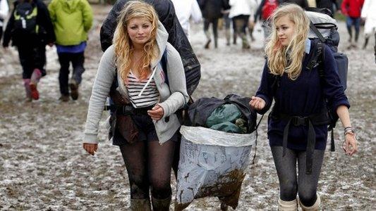 Festival-goers at a muddy Isle of Wight