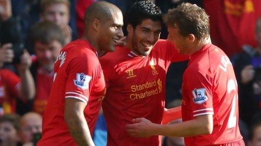 Luis Suarez (center) celebrates with Glenn Johnson (right) and Lucas.