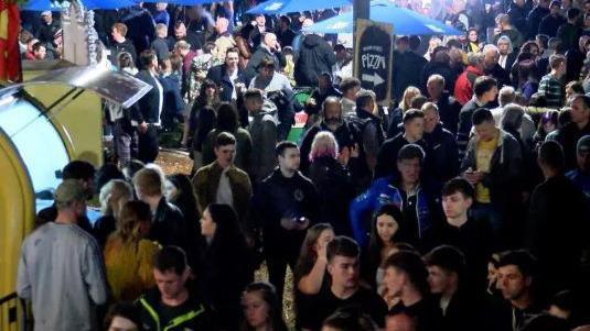 Crowds of revellers in Douglas at night.