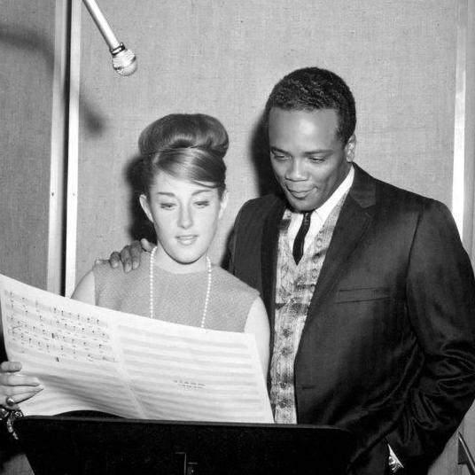 Lesley Gore and Quincy Jones in the recording studio, studying the sheet music