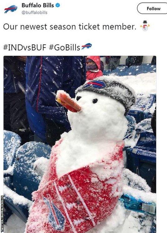 A snowman made by a fan in the stands