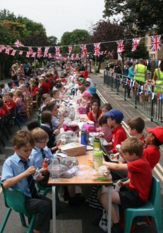 The Queen’s C of E School and Kew College, London, held a street party to celebrate. Credit: The Queen’s C of E School and Kew College