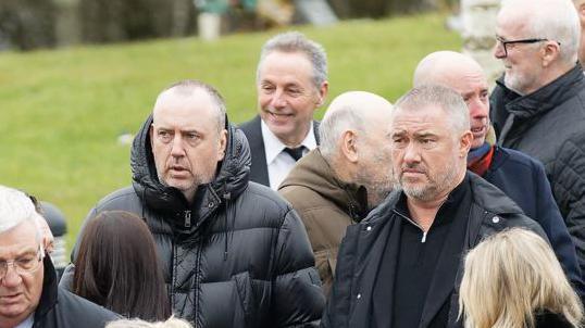 Snooker players Mark Williams and Stephen Hendry at the funeral of fellow player Terry Griffiths