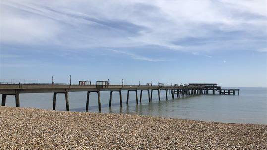 Deal Pier as pictured from the stony beach.