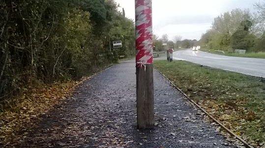 Telegraph pole on cycle path in Cambridgeshire