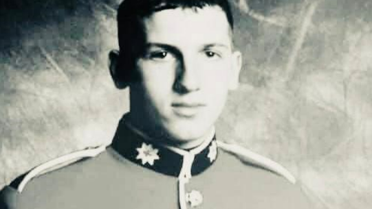 A black and white portrait photograph of Alan Forcer in his guard's full dress uniform.