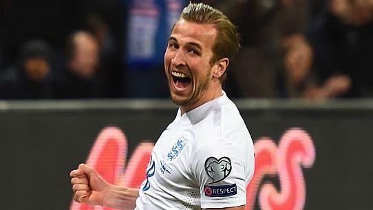 Harry Kane celebrates scoring on his England debut