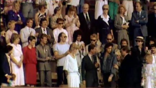 A view of people in the royal box at Live Aid with Dee Flower sat top left in the blue. Charles and Diana are front central 