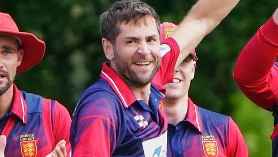 Jersey captain Charles Perchard celebrates taking a wicket