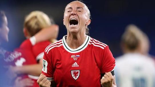 Natasha Harding celebrates a goal during a Wales match