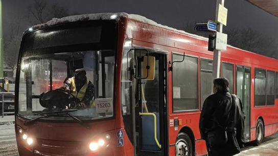 A replacement bus running along a railway line