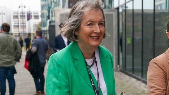 Harriet Harman  wears greens suit and attends  the first day of the Labour Party conference in Liverpool