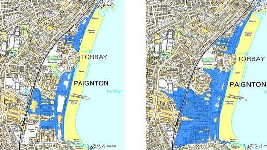 Two road maps of Paignton lay side by side. One shows the current flood risk from a big storm in dark blue. The second shows a much larger blue area. Indicating how much more of Paignton will be affected by coastal flooding in fifty years time, when climate change causes sea levels to rise. It goes up to, and beyond the railway line.