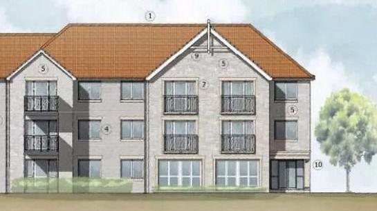 An artist's impression of a three-storey block of flats made of grey stone with large windows, a brown roof and trees outside. There are six balconies.