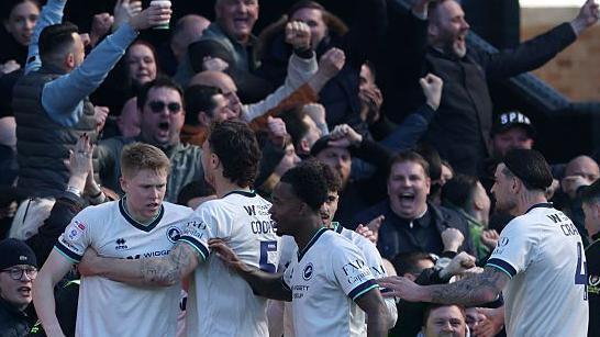 Millwall players celebrate Josh Coburn's goal