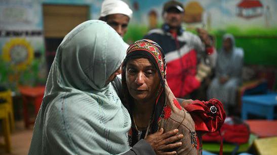 Survivors of the landslide console each other at a relief camp in Wayanad