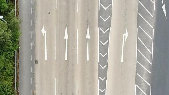 A picture of arrows on a road