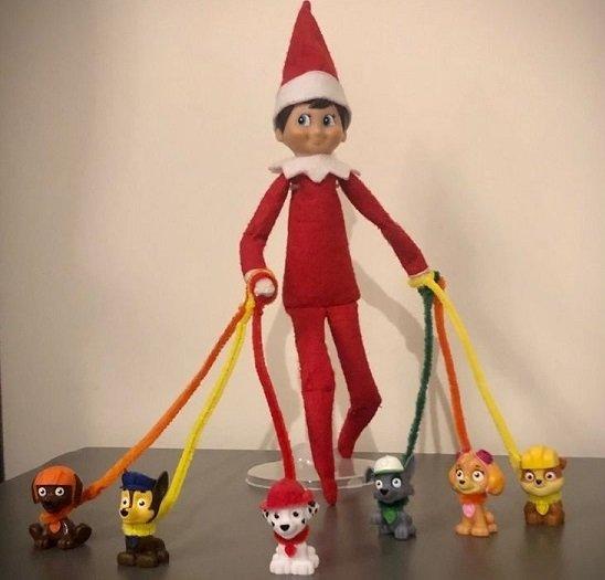 elf with toy dogs on leads