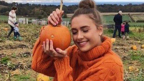 Sarah Alexandra posing with her pumpkin