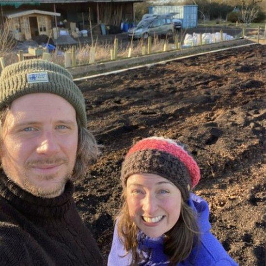 Tristan Faith and a volunteer on the farm