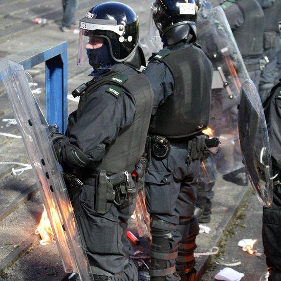 Riot police patrol a terrace in front of Polish fans at Windsor Park in Belfast during the World Cup qualifier in March 2009