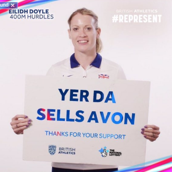 Eilidh Doyle holds a sign superimposed with the slogan: Yer Da sells Avon