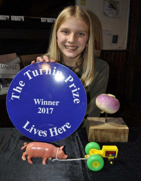 Chris P Bacon with her Turnip Prize and 'Pulled Pork'