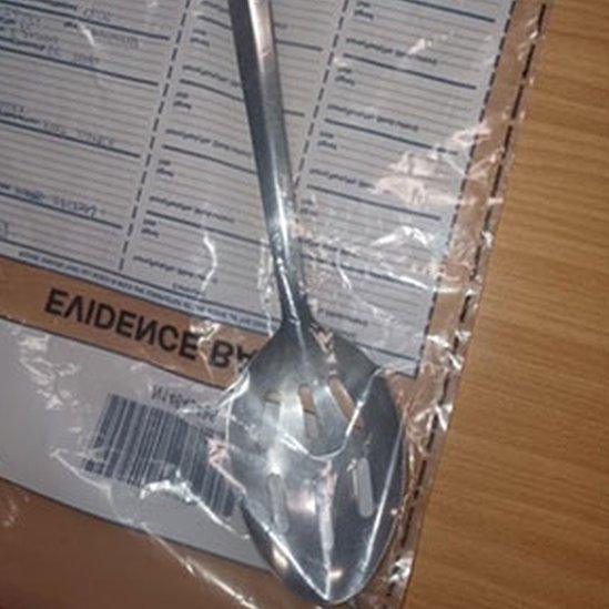 The spoon sealed in an evidence bag