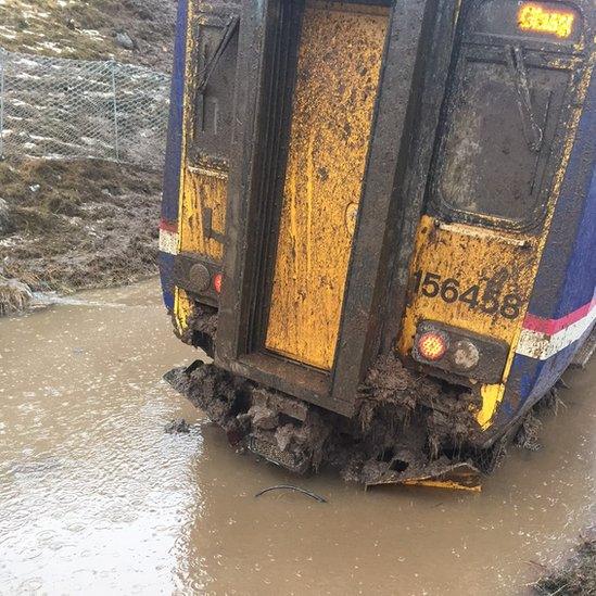 Train trapped in landslide