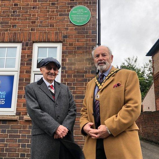 Derek Seaton and Dan Harrison with the plaque for Captain Robert Gee