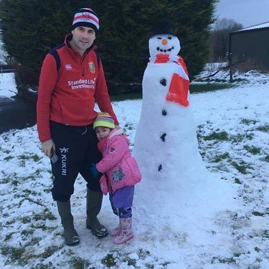 Three-year-old Harmony building her first snowman with her dad Simon in Upper Ballinderry