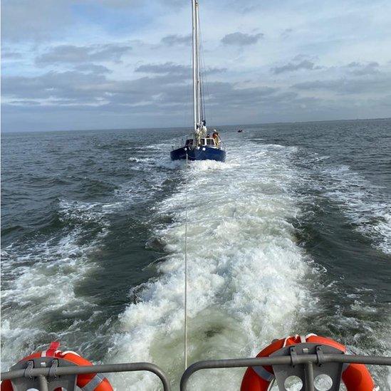 Yacht being towed to safety