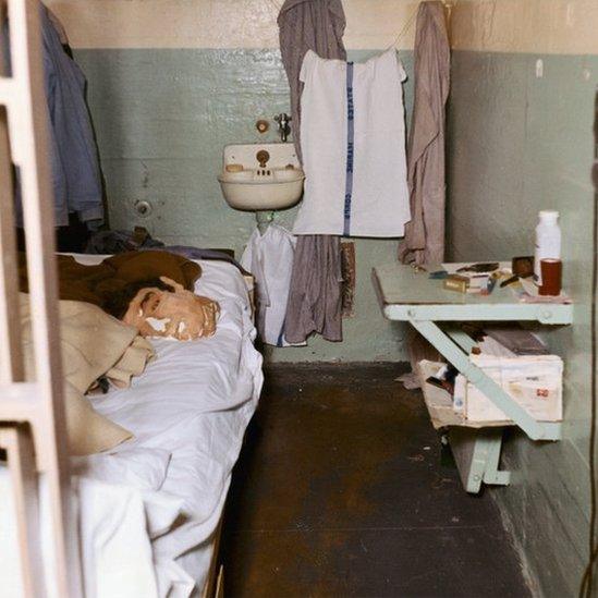 Original photograph shows Alcatraz cell with dummy head in it