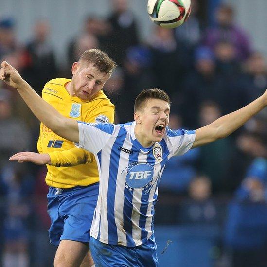 Ballymena United's David Cushley beats Brad Lyons of Coleraine to a high ball during the Boxing Day Irish Premiership clash