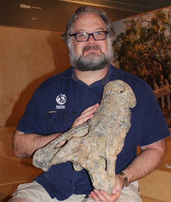 Adam Yates holding up crocodile skull