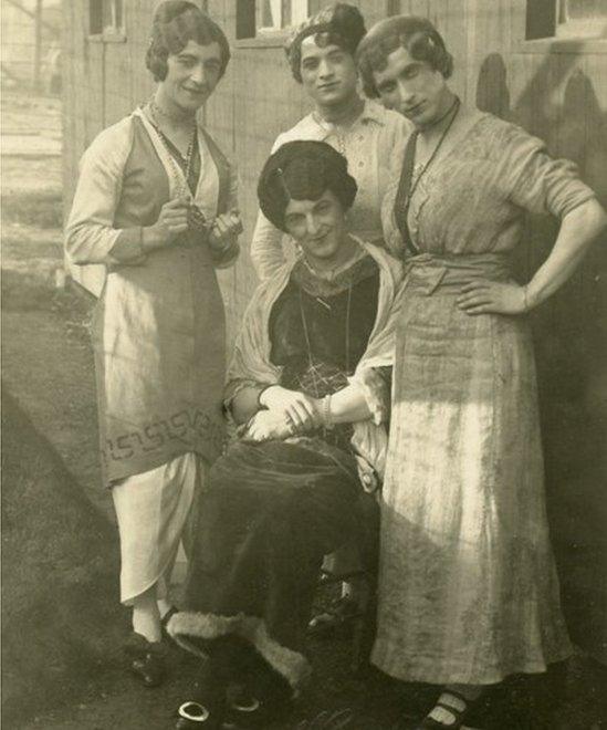 Male internees dressed as women for a performance