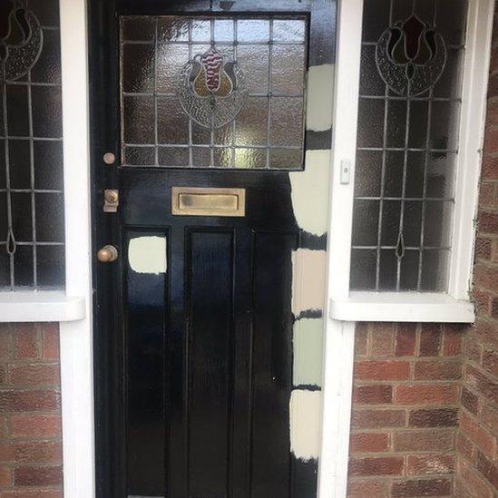 Front door with different coloured patches