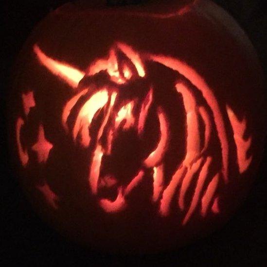 Unicorn carved into a pumpkin