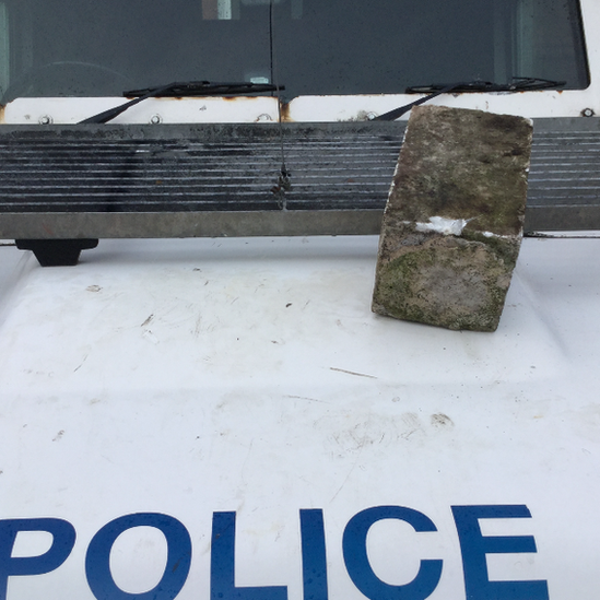 Stone thrown at police